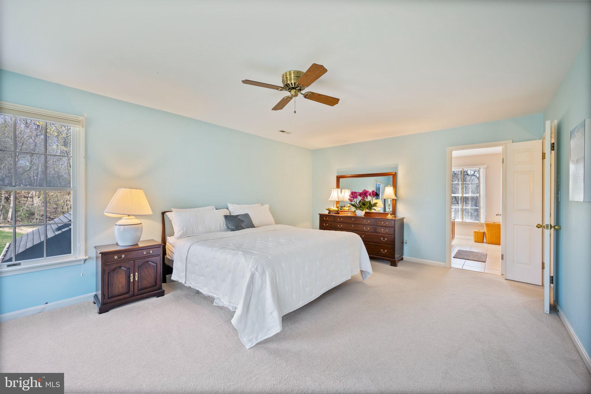 12 Sparks Station Road Sparks Glencoe, MD 21152 - Photo 25 of 57 a bedroom with a large bed and a chandelier