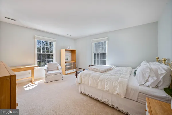 a bathroom with a granite countertop sink mirror and a shower