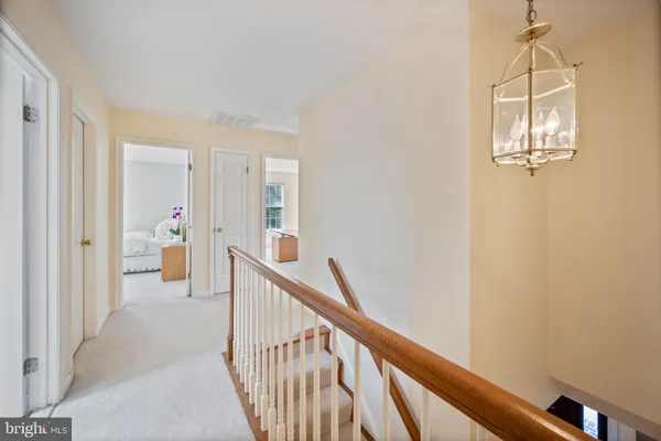 a view of a house with backyard and deck