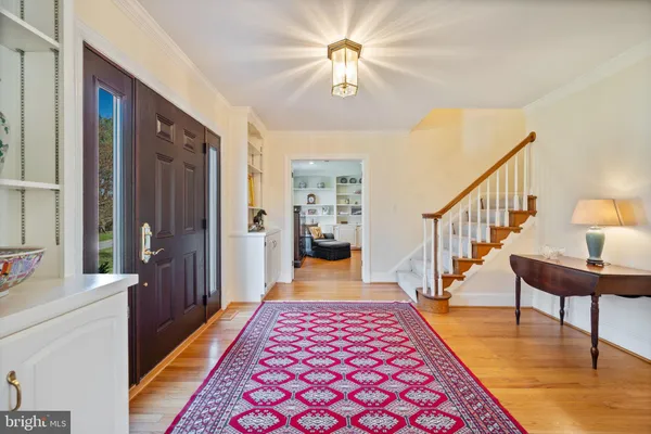 a bedroom with furniture and a rug