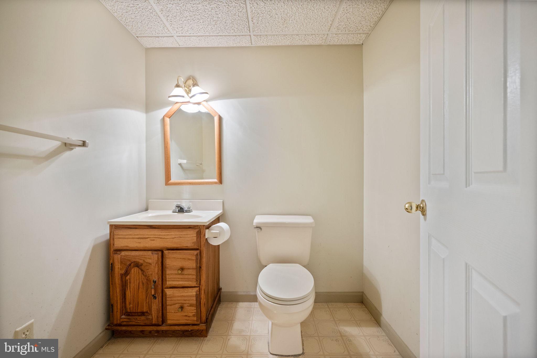 12 Sparks Station Road Sparks Glencoe, MD 21152 - Photo 41 of 57 a bathroom with a toilet a sink and mirror