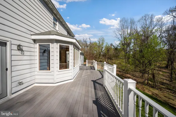 an aerial view of a house with garden space and street view