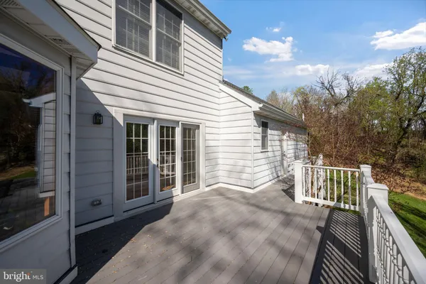 a view of a yard with large trees