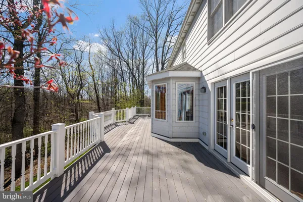 an aerial view of a house with a lake view