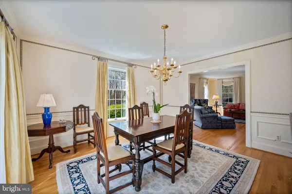 a large kitchen with stainless steel appliances kitchen island granite countertop a large kitchen island a stove a sink a refrigerator and cabinets