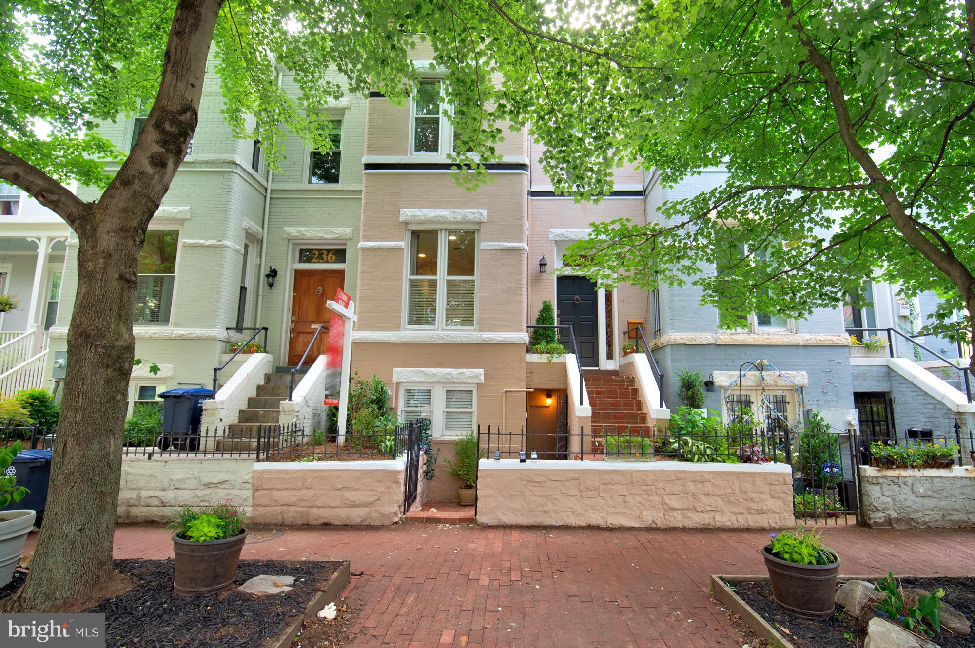 238 10th Street Northeast Washington, DC 20002 - Photo 1 of 30 a front view of a house with garden