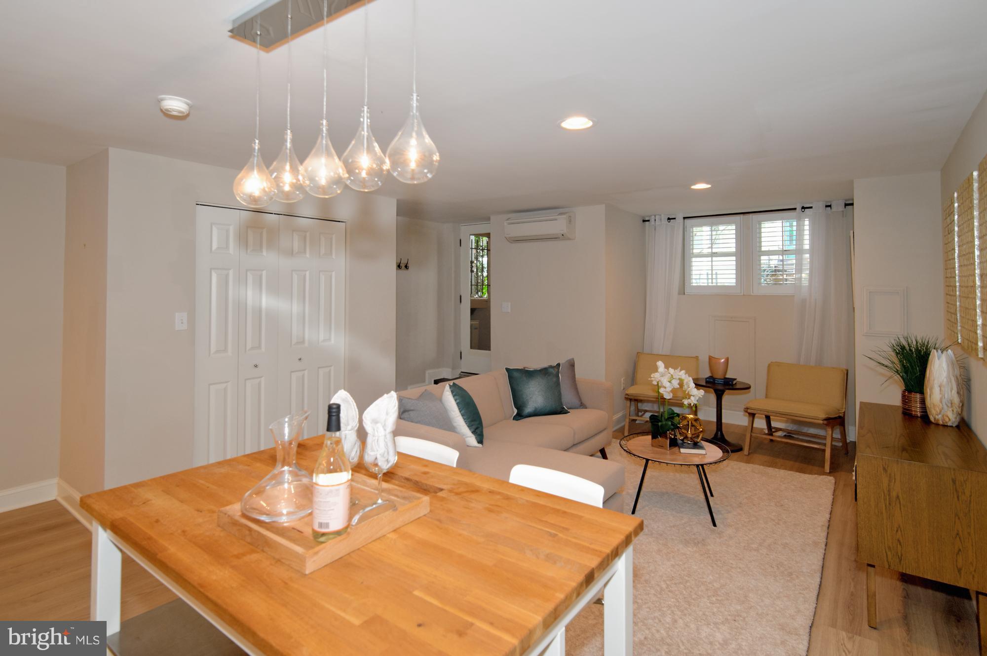 238 10th Street Northeast Washington, DC 20002 - Photo 14 of 30 a dining room with furniture and chandelier