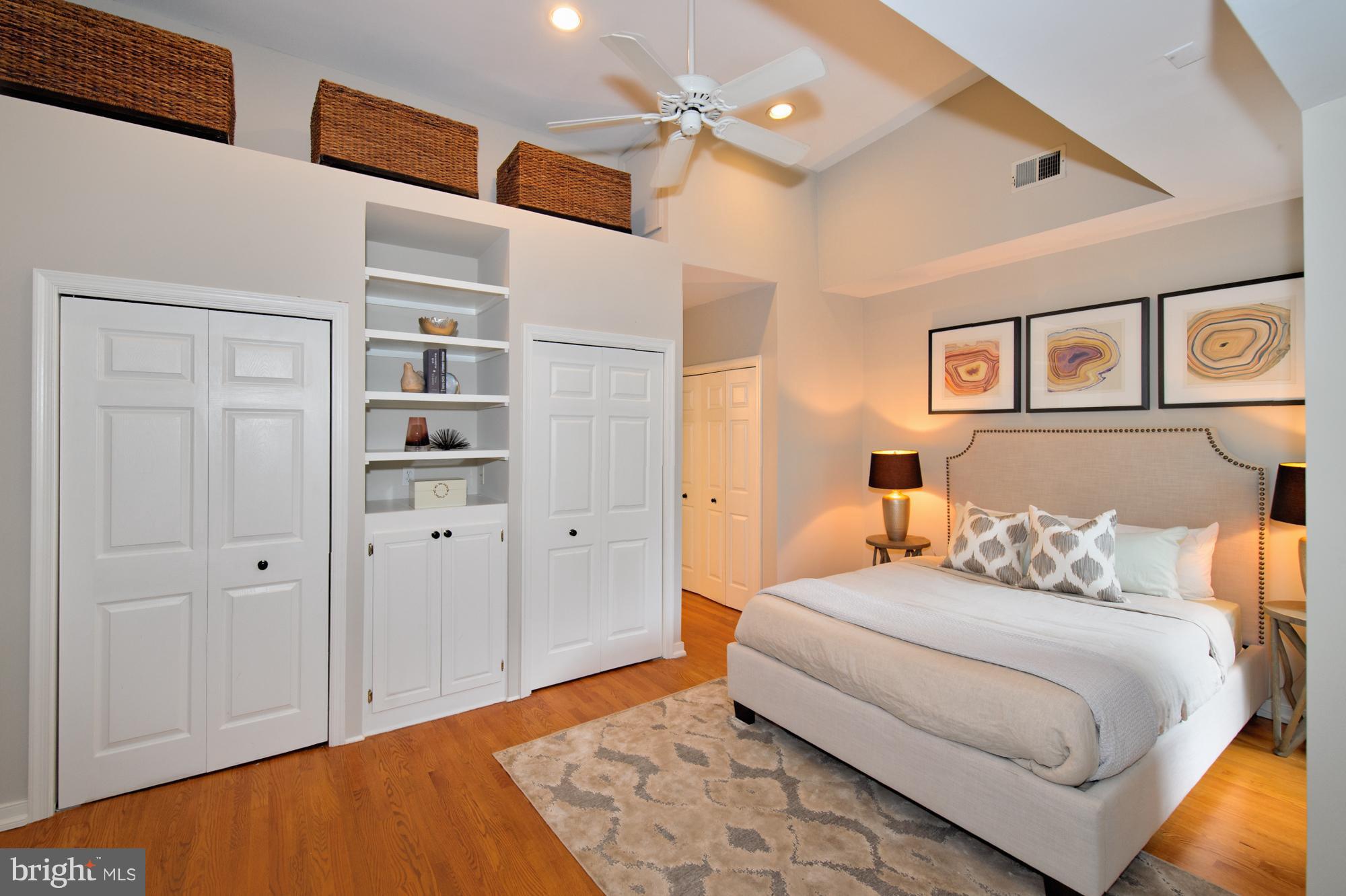 238 10th Street Northeast Washington, DC 20002 - Photo 17 of 30 a bedroom with a bed and cabinets