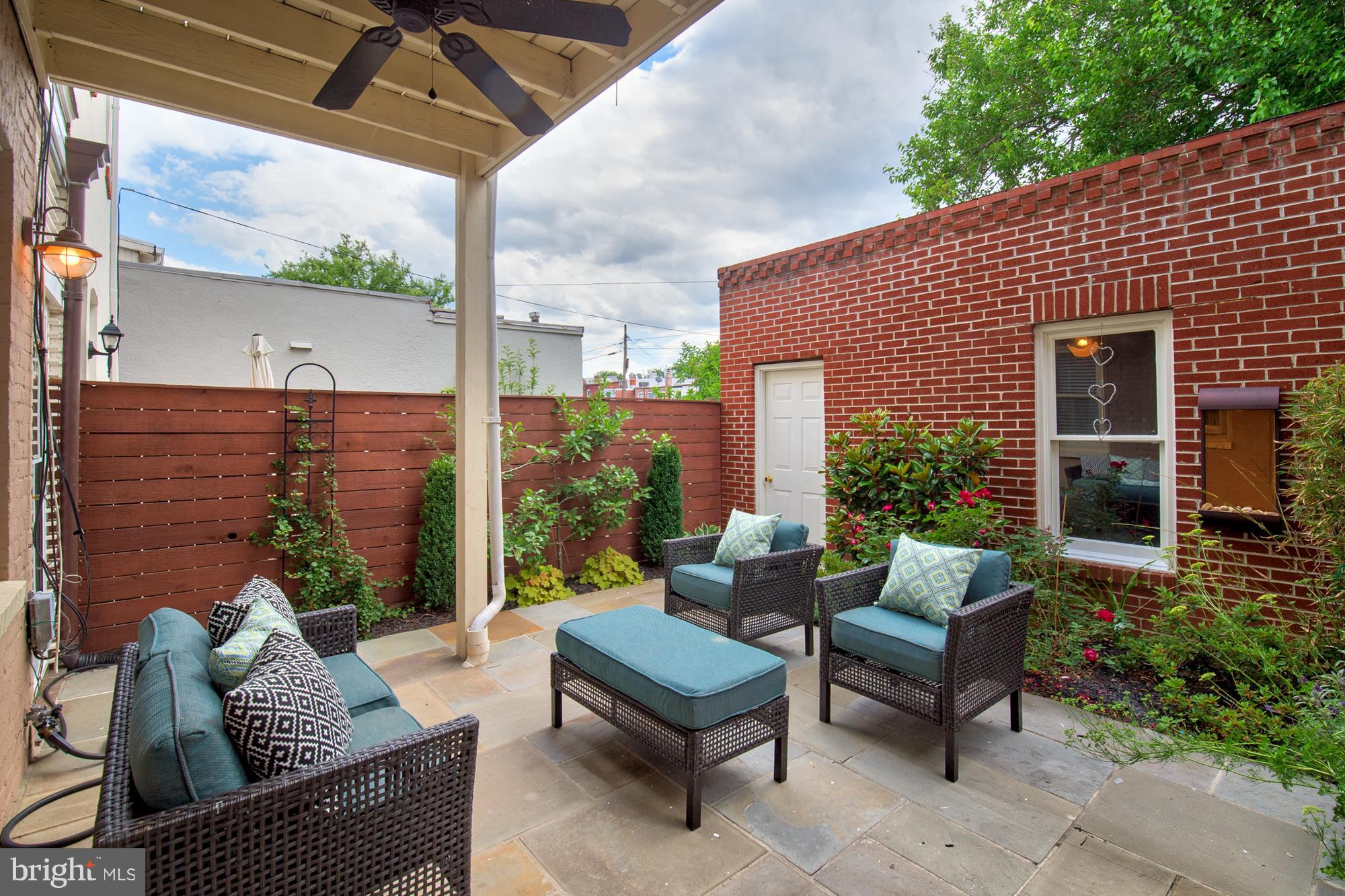 238 10th Street Northeast Washington, DC 20002 - Photo 26 of 30 a view of a patio with couches table and chairs and potted plants