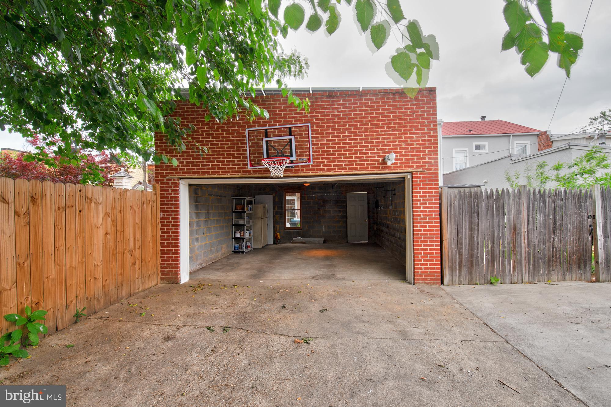 238 10th Street Northeast Washington, DC 20002 - Photo 29 of 30 a view of a house with a garage and yard