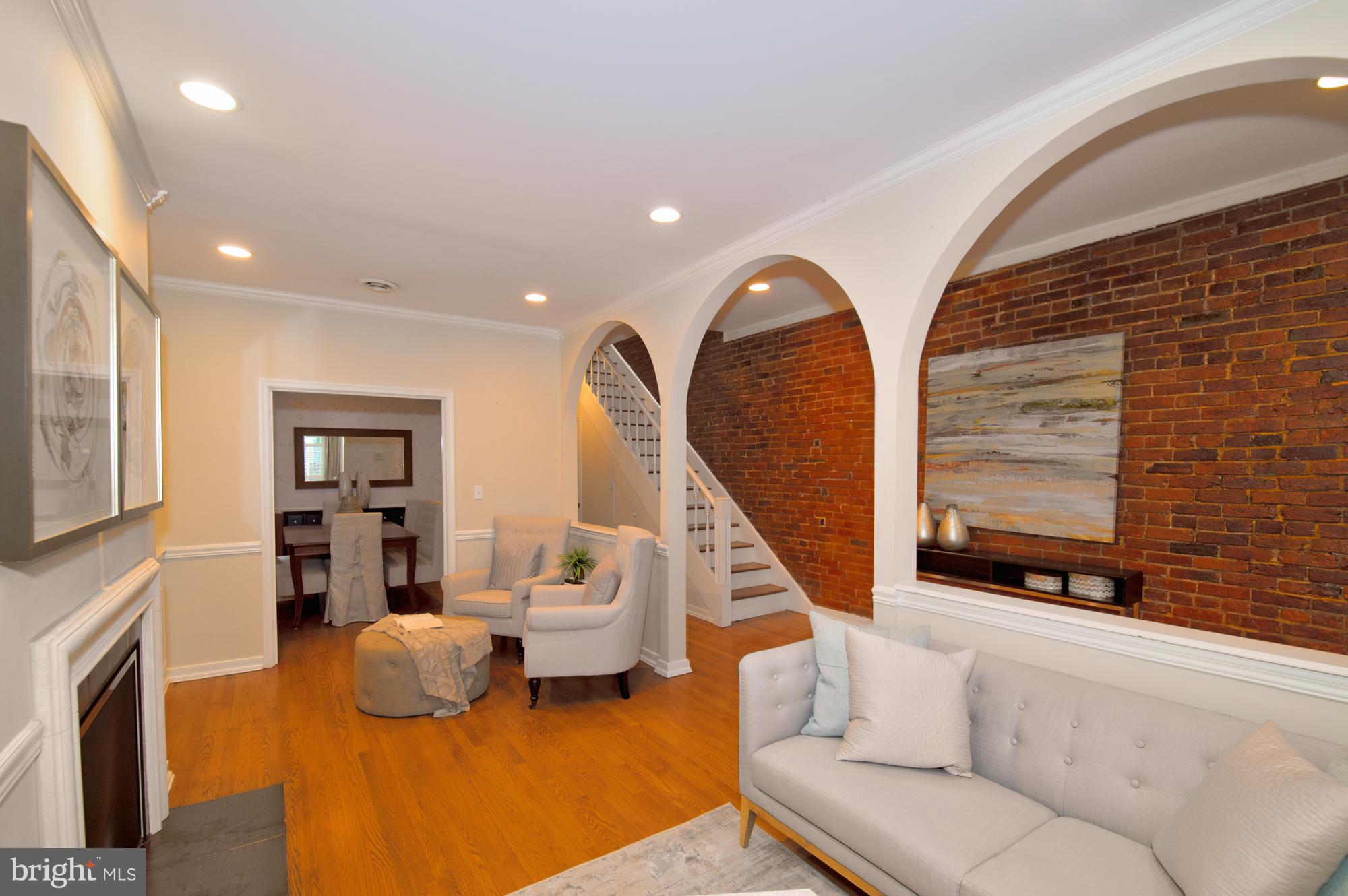 238 10th Street Northeast Washington, DC 20002 - Photo 4 of 30 a living room with furniture and a fireplace