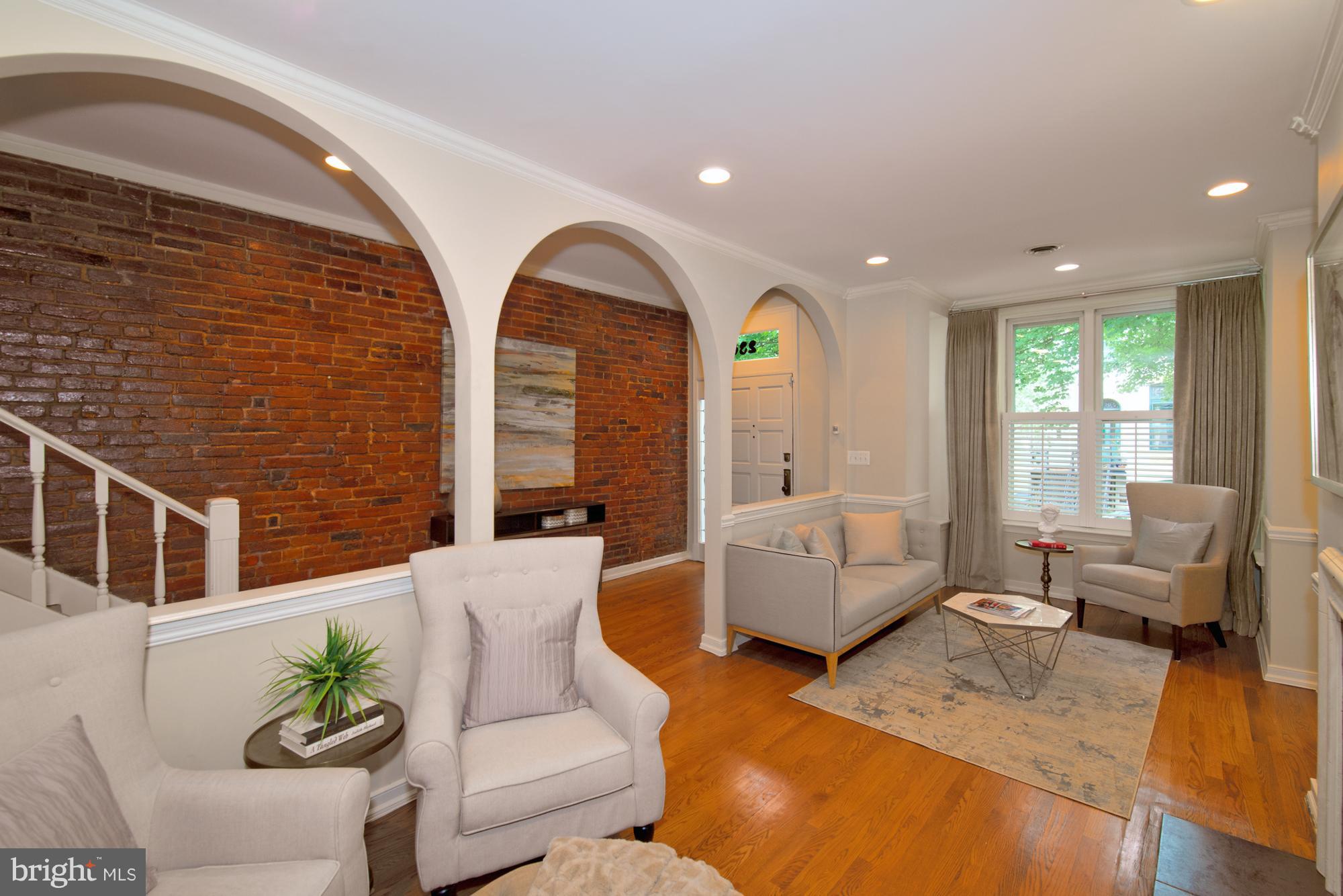 238 10th Street Northeast Washington, DC 20002 - Photo 5 of 30 a living room with furniture and wooden floor