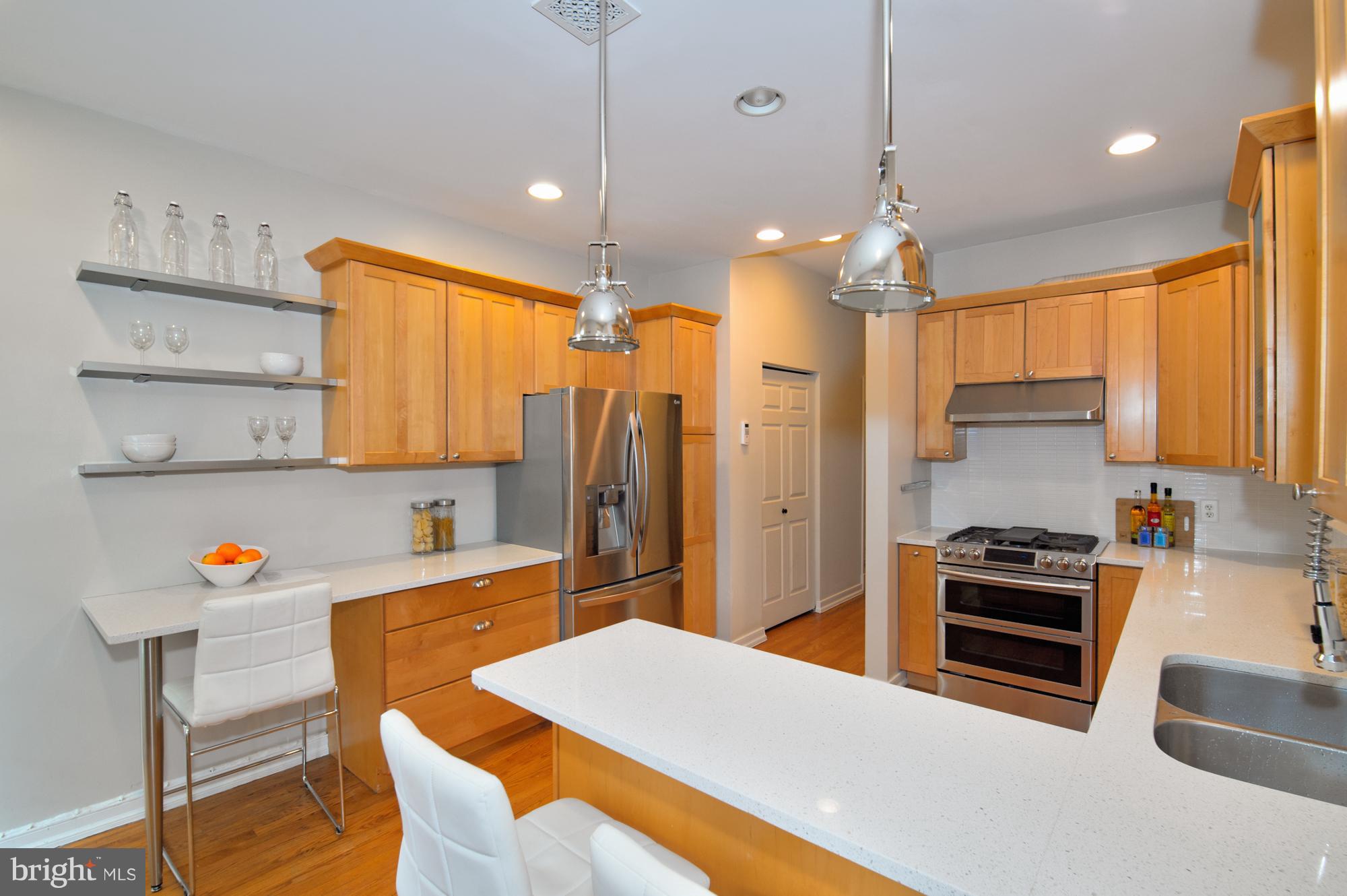 238 10th Street Northeast Washington, DC 20002 - Photo 8 of 30 a kitchen with a refrigerator a stove and a cabinets