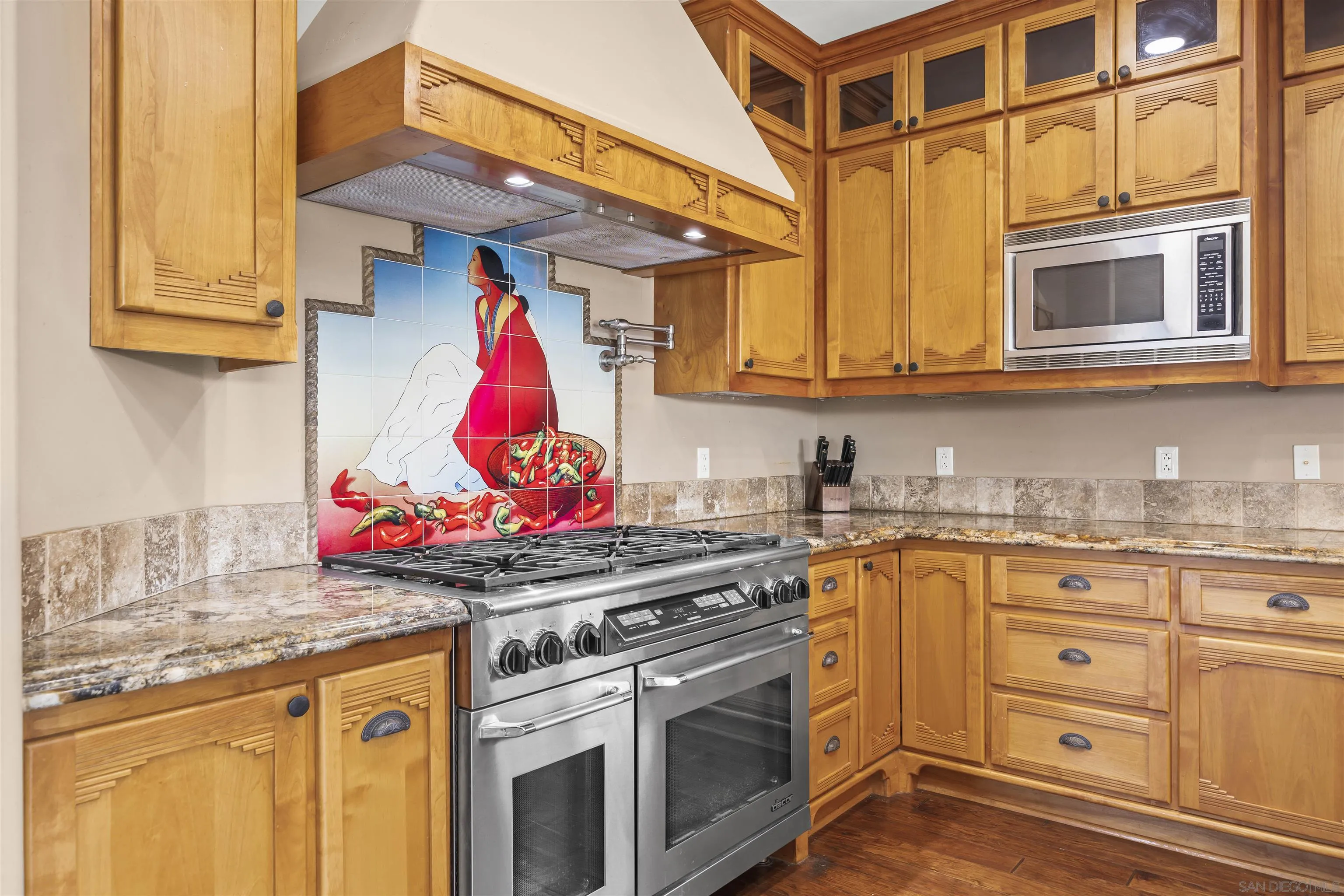 16951 Old Coach Road Poway, CA 92064 - Photo 11 of 70 a kitchen with stainless steel appliances granite countertop a sink and a stove