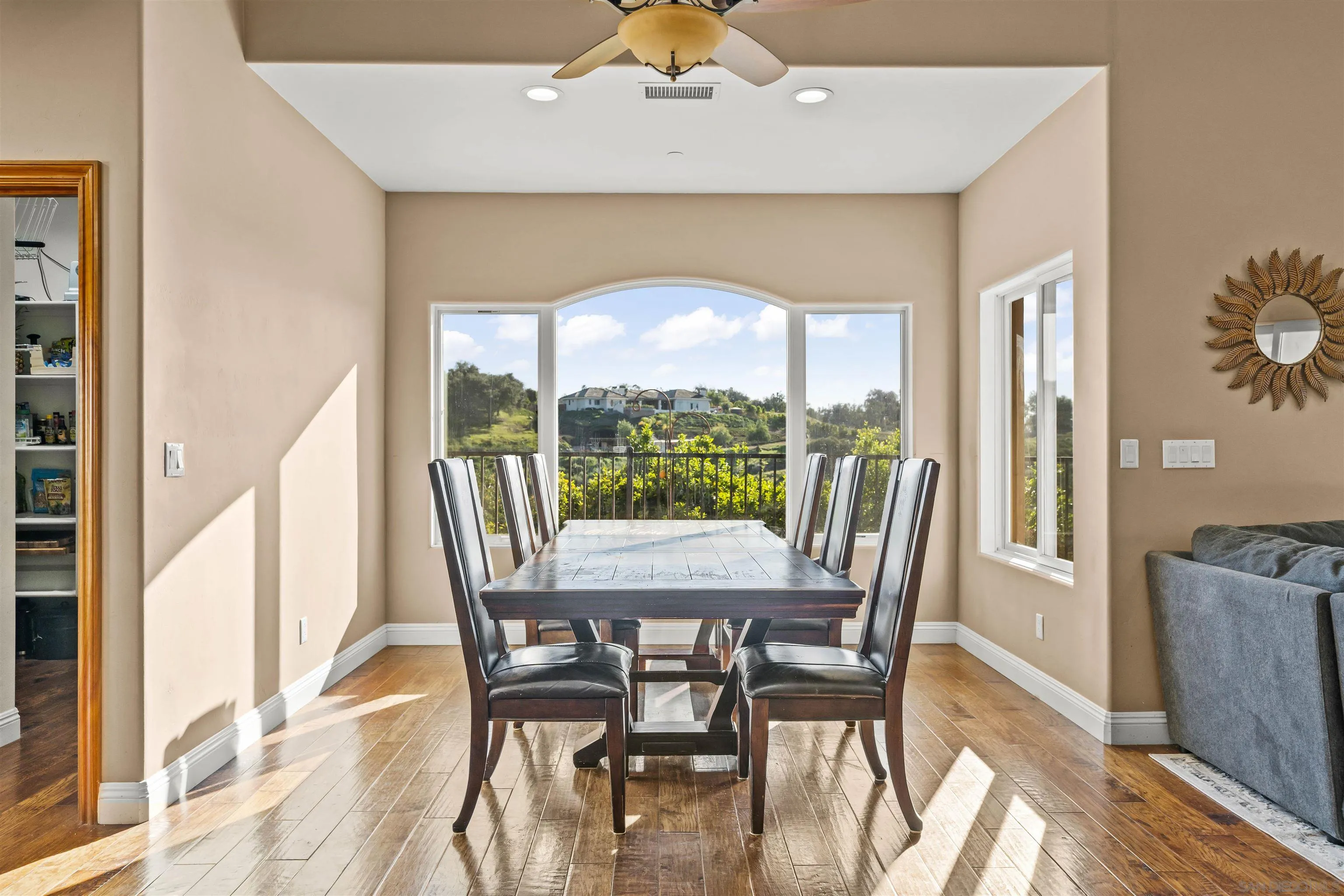 16951 Old Coach Road Poway, CA 92064 - Photo 14 of 70 a view of a dining room with furniture window and wooden floor