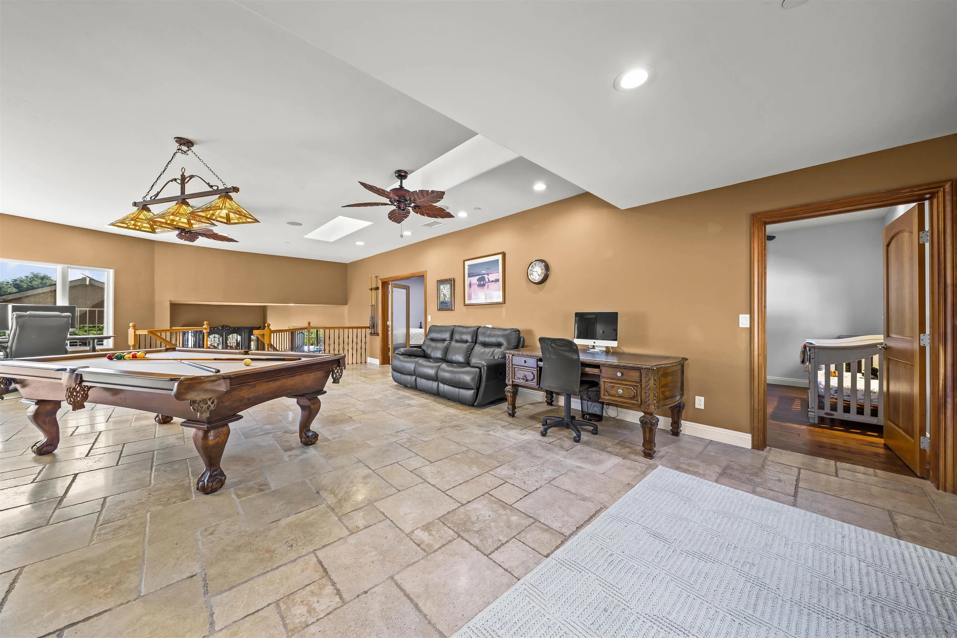 16951 Old Coach Road Poway, CA 92064 - Photo 29 of 70 a living room with furniture a rug and a chandelier