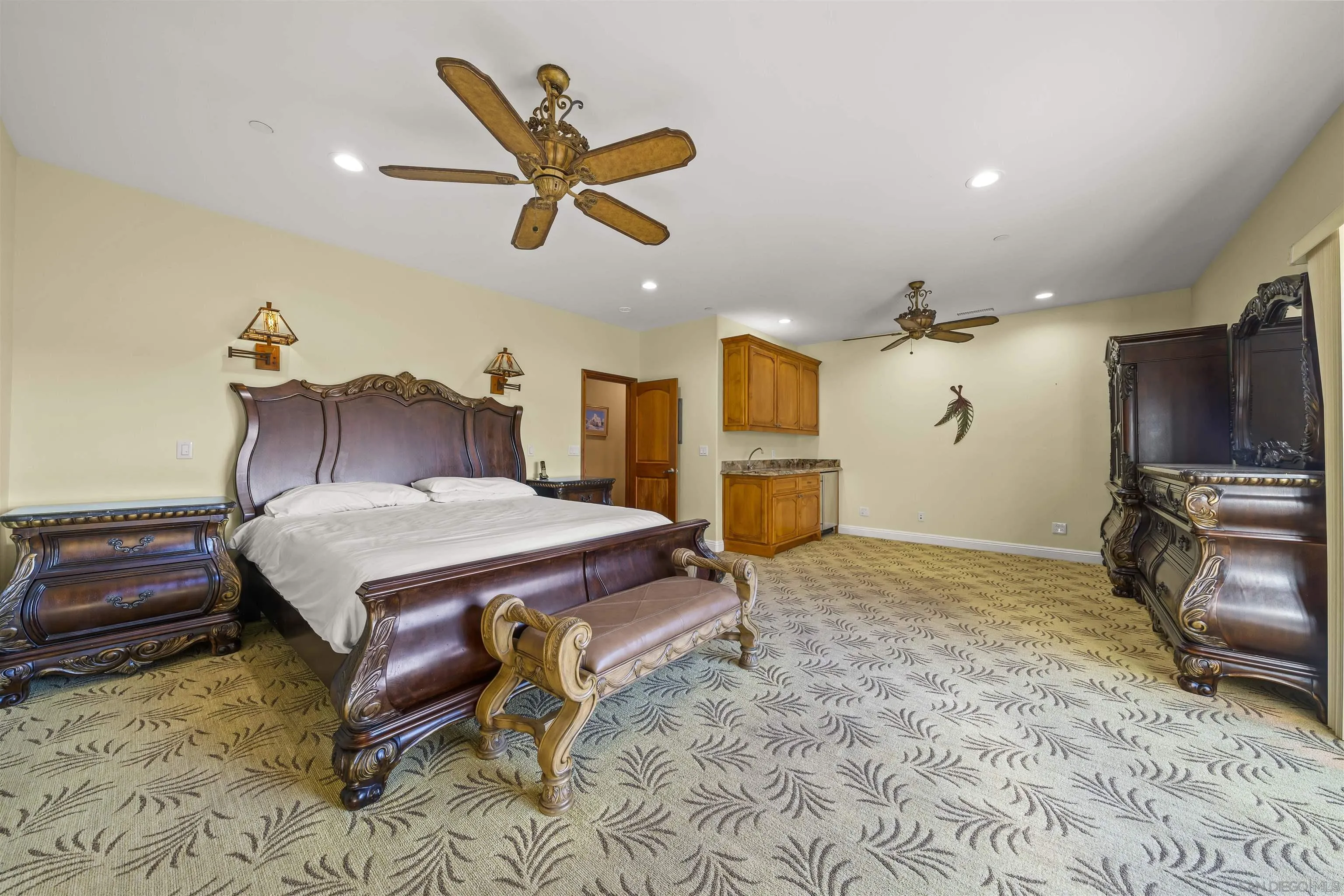 16951 Old Coach Road Poway, CA 92064 - Photo 32 of 70 a bedroom with a bed a flat screen tv and dresser