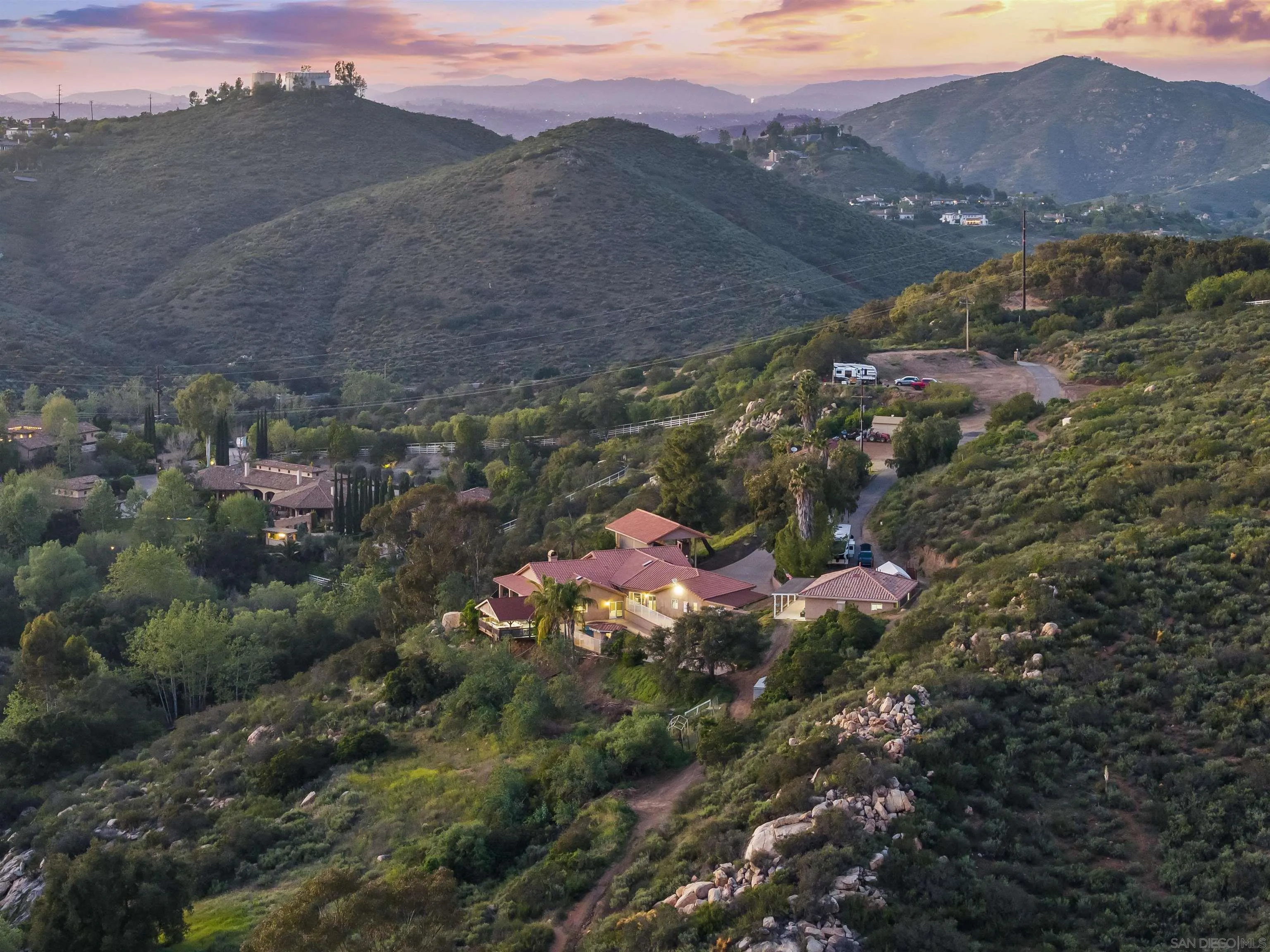 16951 Old Coach Road Poway, CA 92064 - Photo 5 of 70 a view of a house with a mountain and a forest