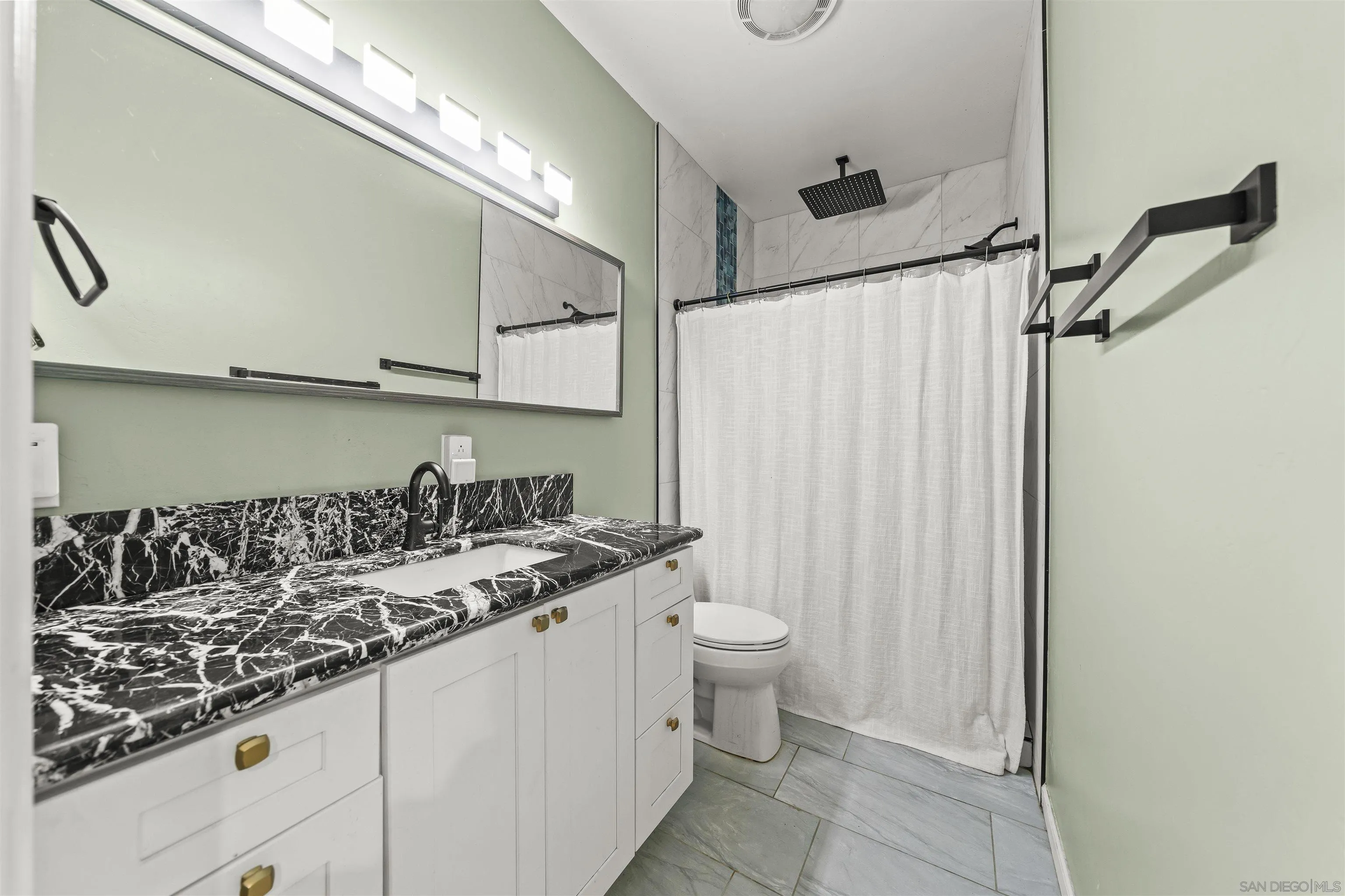 16951 Old Coach Road Poway, CA 92064 - Photo 57 of 70 a bathroom with a granite countertop sink and a mirror