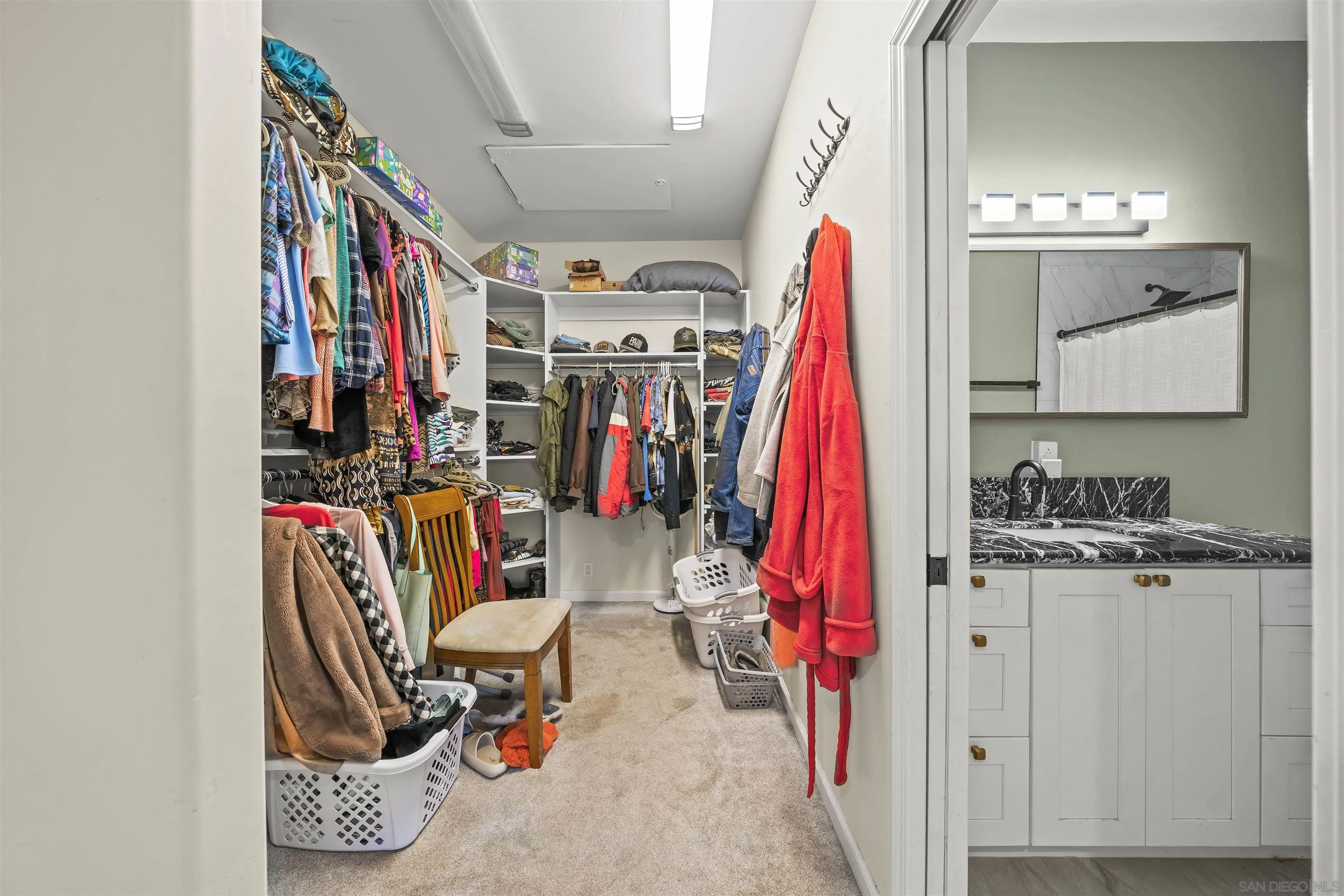 16951 Old Coach Road Poway, CA 92064 - Photo 59 of 70 a view of walk in closet with clothes and shoes