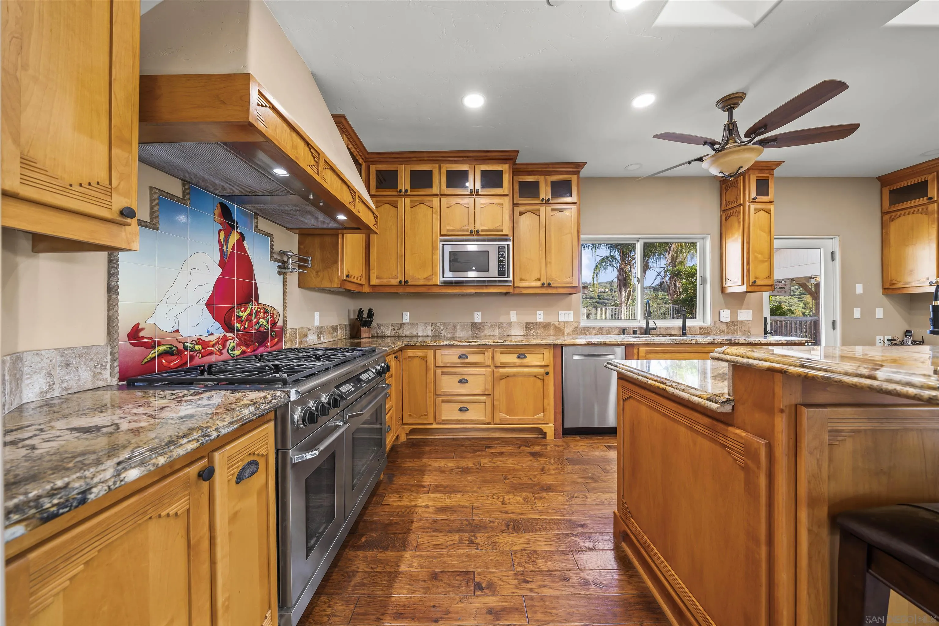 16951 Old Coach Road Poway, CA 92064 - Photo 9 of 70 a kitchen with stainless steel appliances granite countertop a sink and cabinets