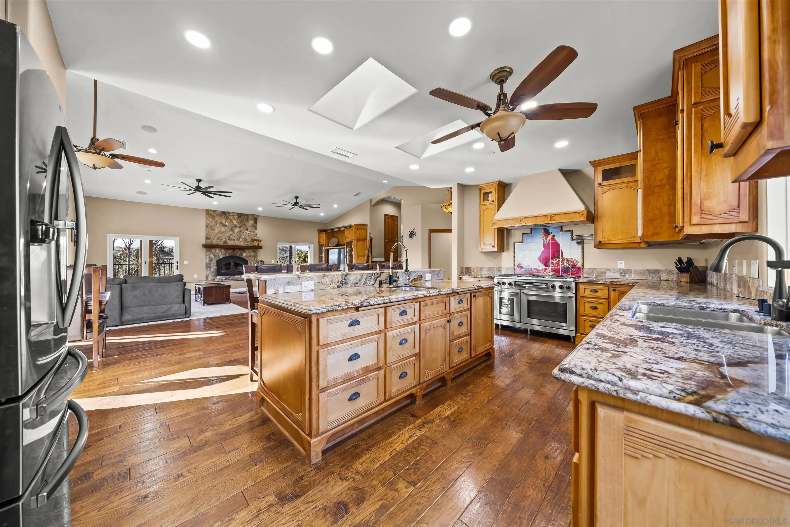 16951 Old Coach Road Poway, CA 92064 - Photo 10 of 70 a kitchen with stainless steel appliances granite countertop a sink and cabinets