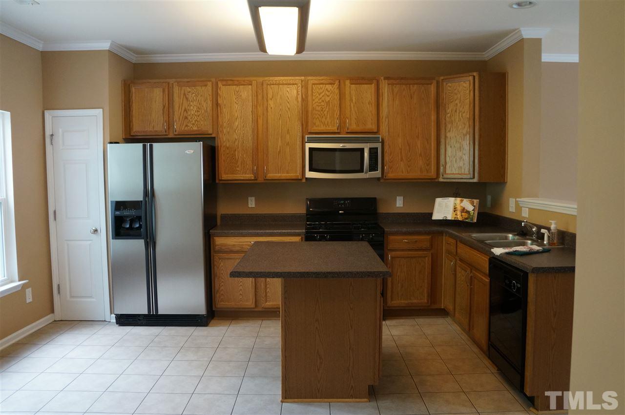 11954 Field Towne Lane Raleigh, NC 27614 - Photo 5 of 16 Large Kitchen With Center Island, Plenty of Storage, Gas Range and Refrigerator