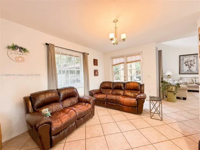 a backyard of a house with yard and outdoor seating