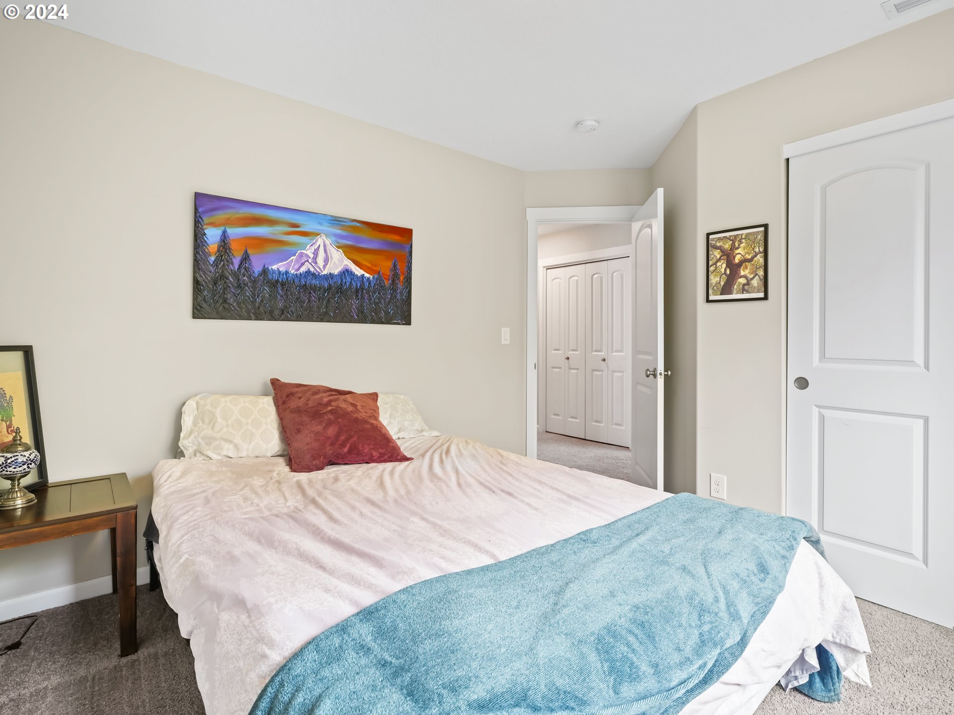 35 North 42nd Place Ridgefield, WA 98642 - Photo 17 of 31 a bedroom with a bed and a painting on the wall