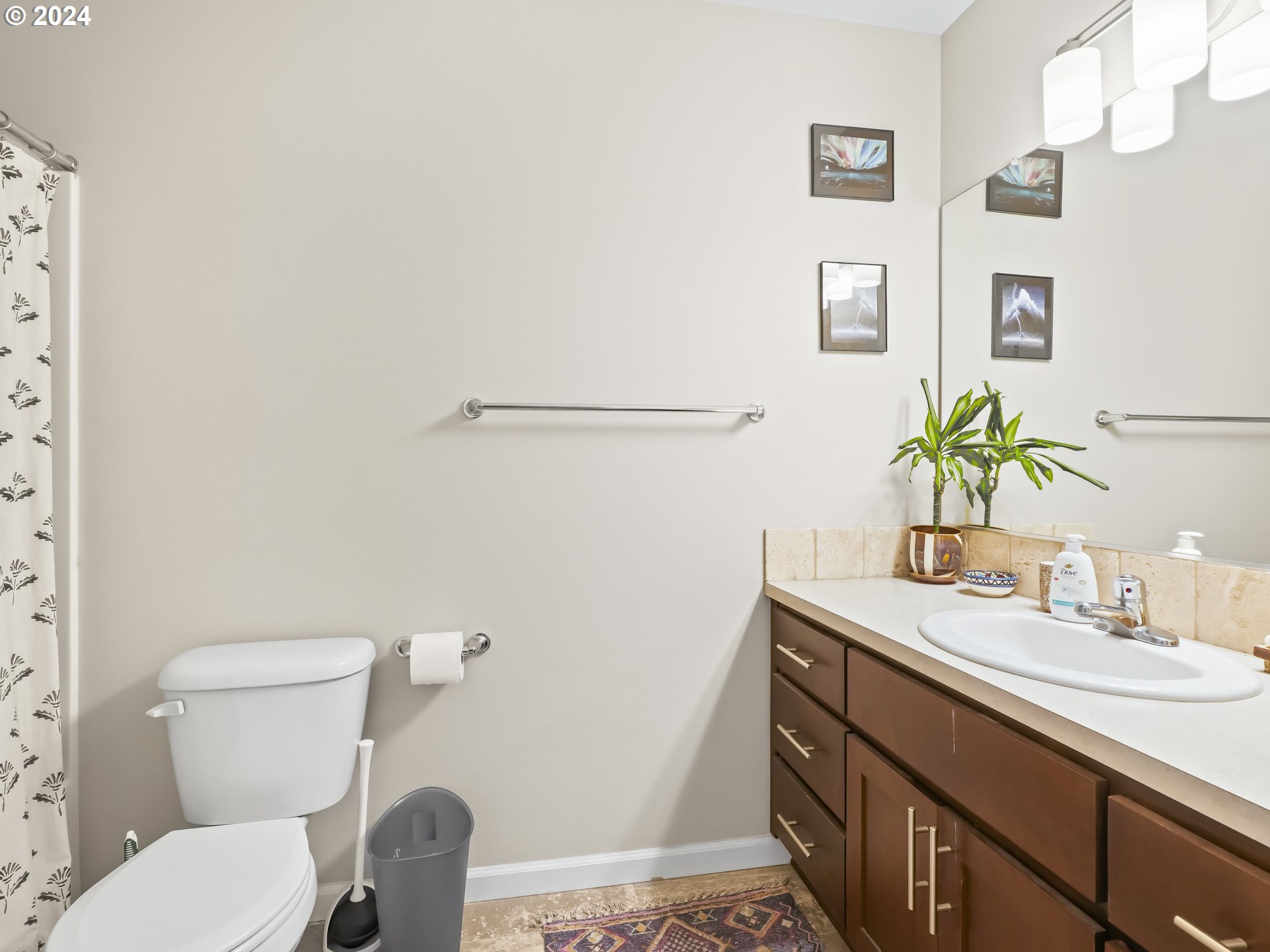 35 North 42nd Place Ridgefield, WA 98642 - Photo 20 of 31 a bathroom with a granite countertop toilet sink and mirror