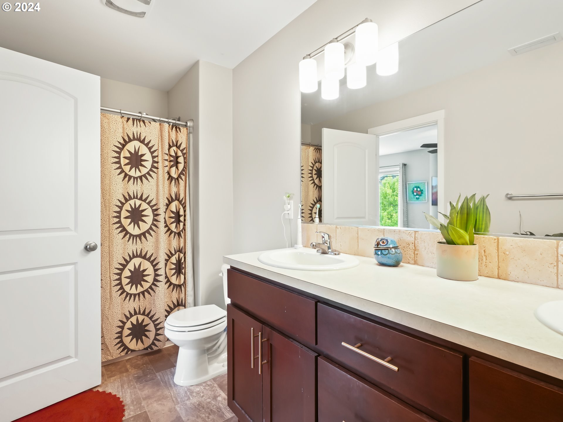 35 North 42nd Place Ridgefield, WA 98642 - Photo 26 of 31 a bathroom with a sink a toilet and a mirror