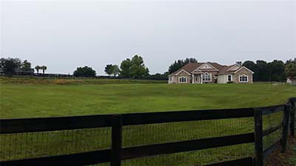 13243 Northwest 82 St Road Ocala, FL 34482 - Photo 1 of 1 a view of a field with an ocean view