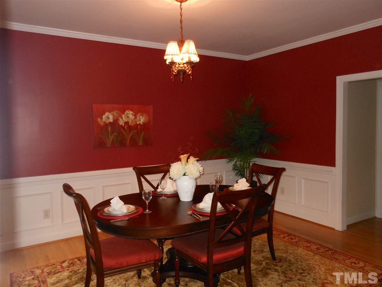 8409 Yucca Trail Raleigh, NC 27615 - Photo 11 of 25 a view of a dining room with furniture and chandelier