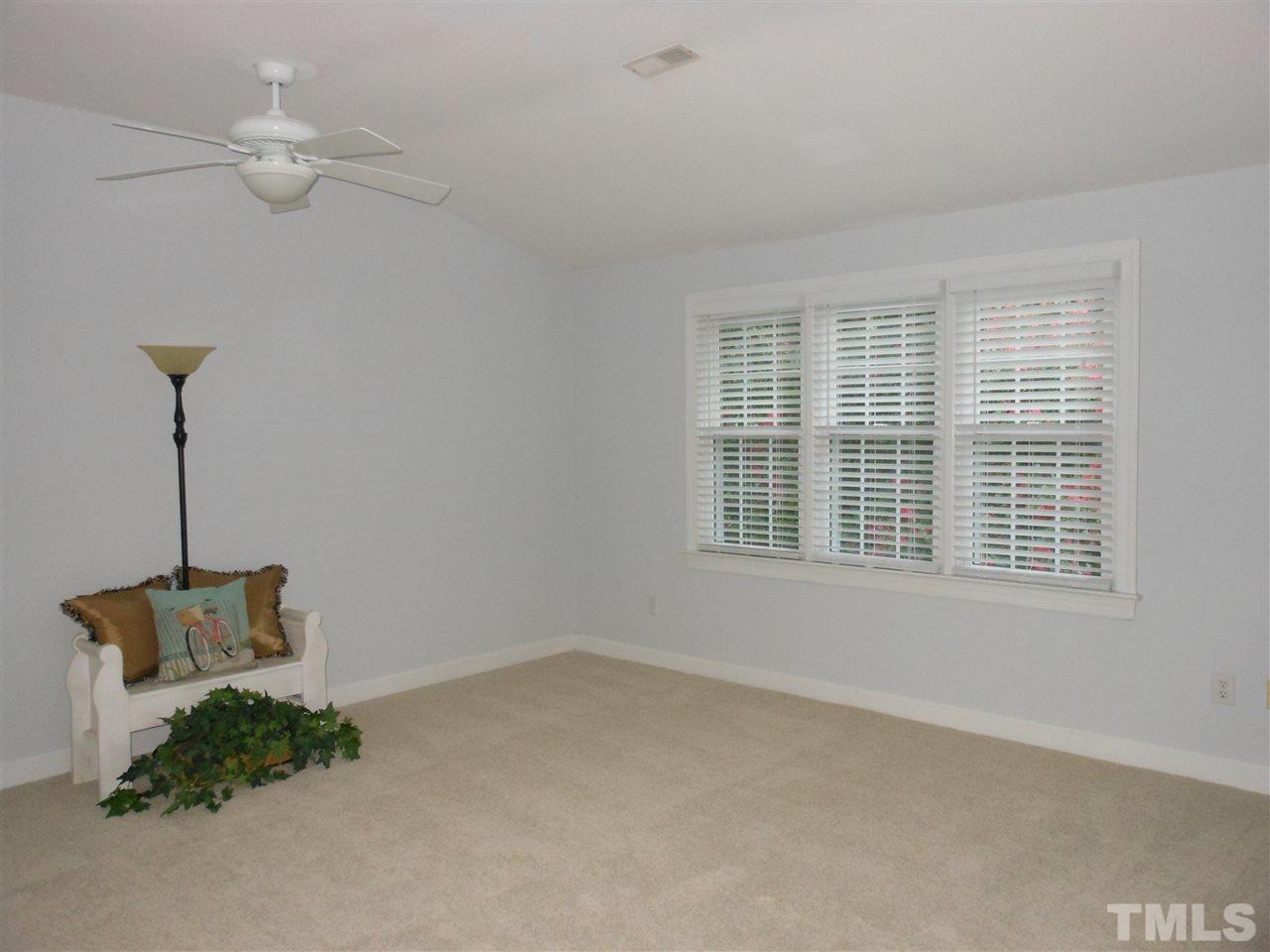 8409 Yucca Trail Raleigh, NC 27615 - Photo 17 of 25 a view of an empty room with a window
