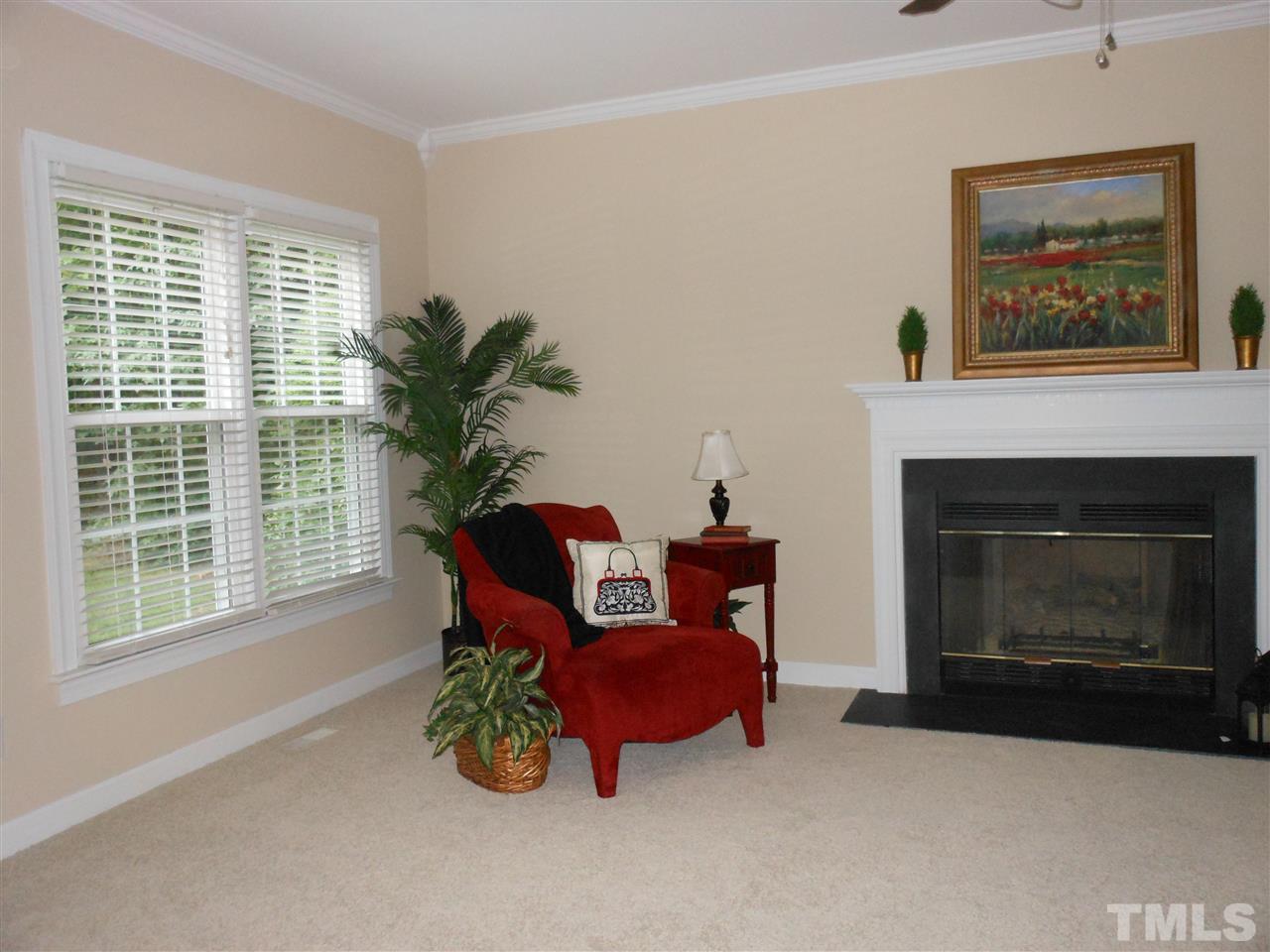 8409 Yucca Trail Raleigh, NC 27615 - Photo 3 of 25 a living room with furniture large window and fireplace