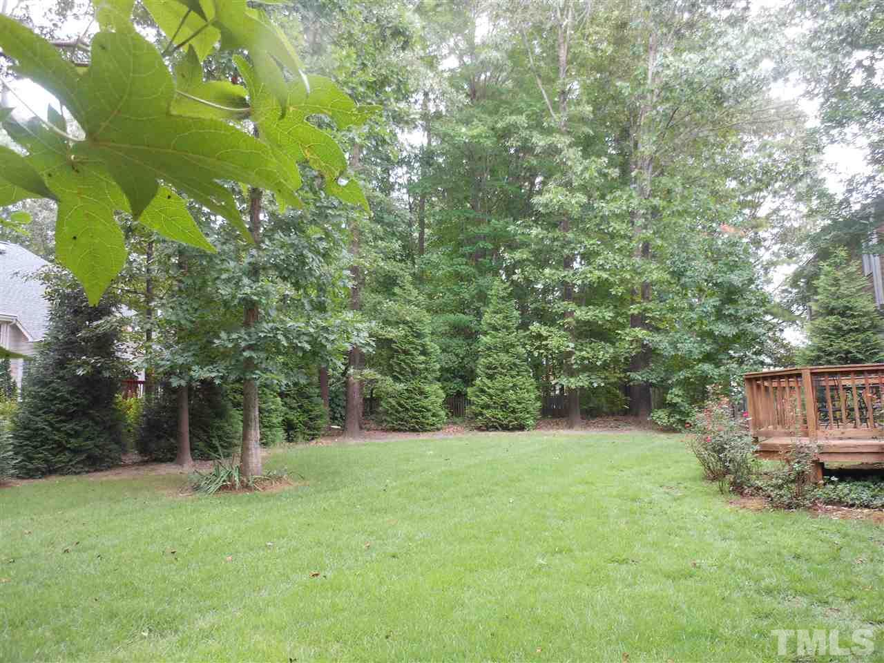 8409 Yucca Trail Raleigh, NC 27615 - Photo 22 of 25 a front view of a house with a yard