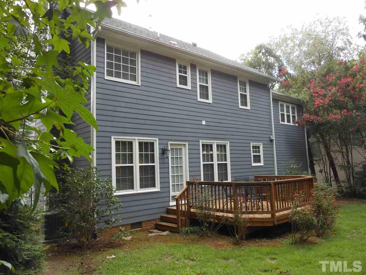 8409 Yucca Trail Raleigh, NC 27615 - Photo 24 of 25 a front view of a house with a yard