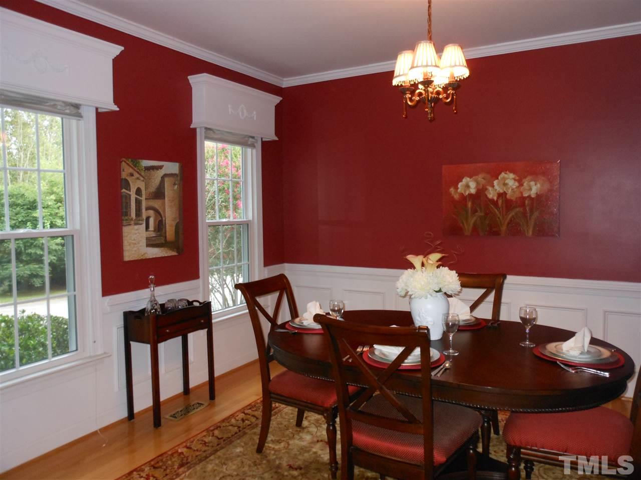 8409 Yucca Trail Raleigh, NC 27615 - Photo 10 of 25 a view of a dining room with furniture and chandelier