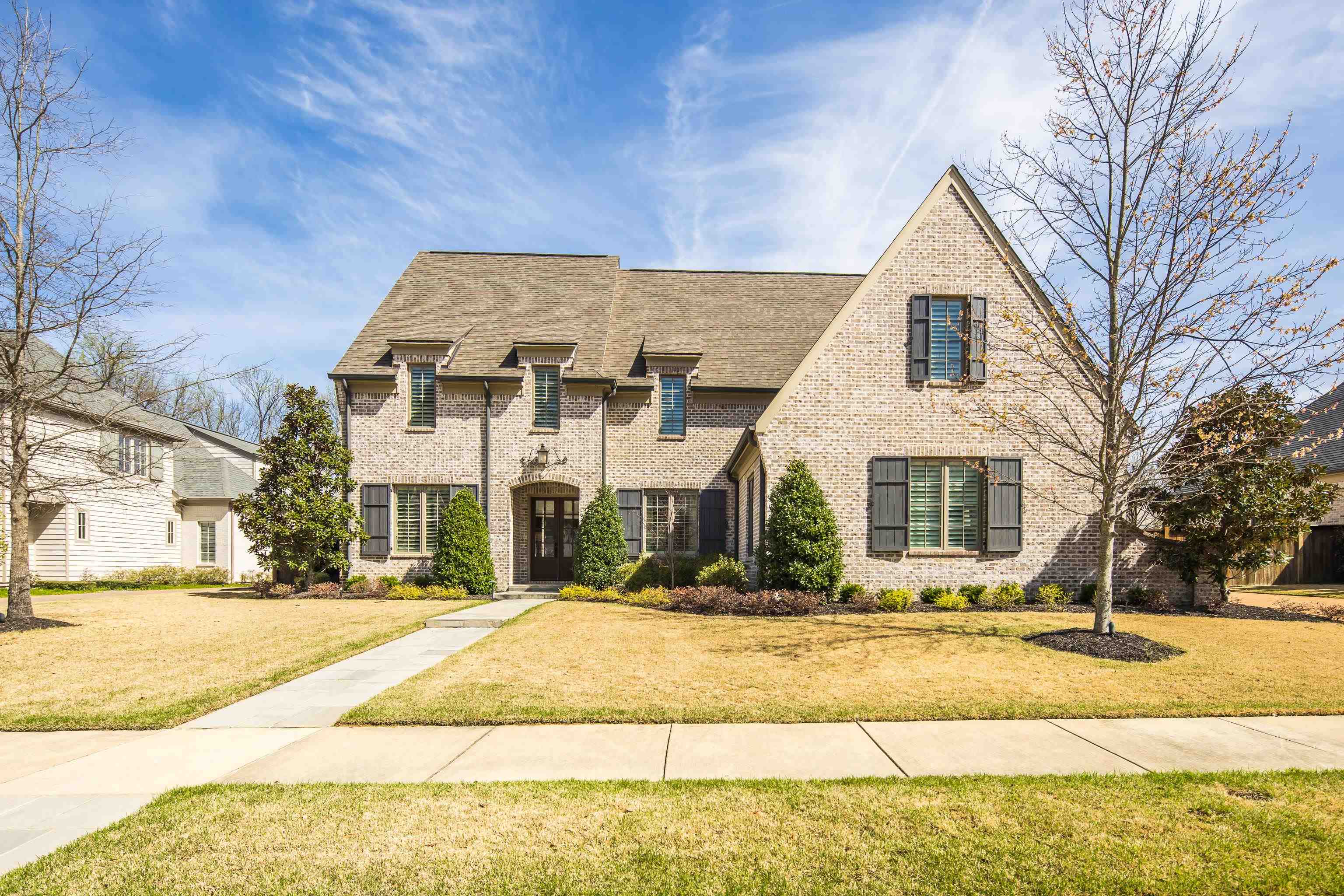 516 Lambs Brook Lane Collierville, TN 38017 - Photo 1 of 39 View of front of house featuring a front lawn, brick siding, and roof with shingles