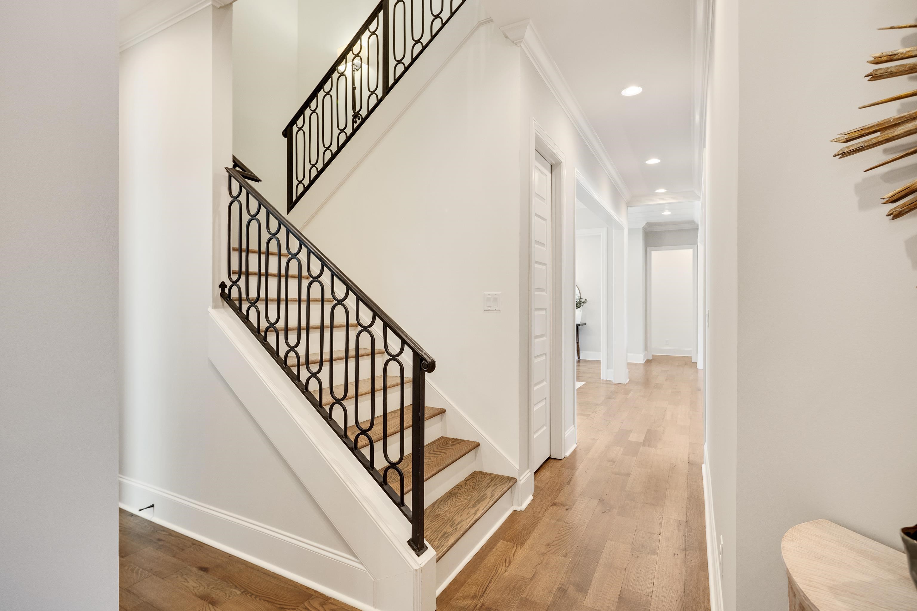516 Lambs Brook Lane Collierville, TN 38017 - Photo 24 of 39 a view of a hallway with wooden floor and staircase