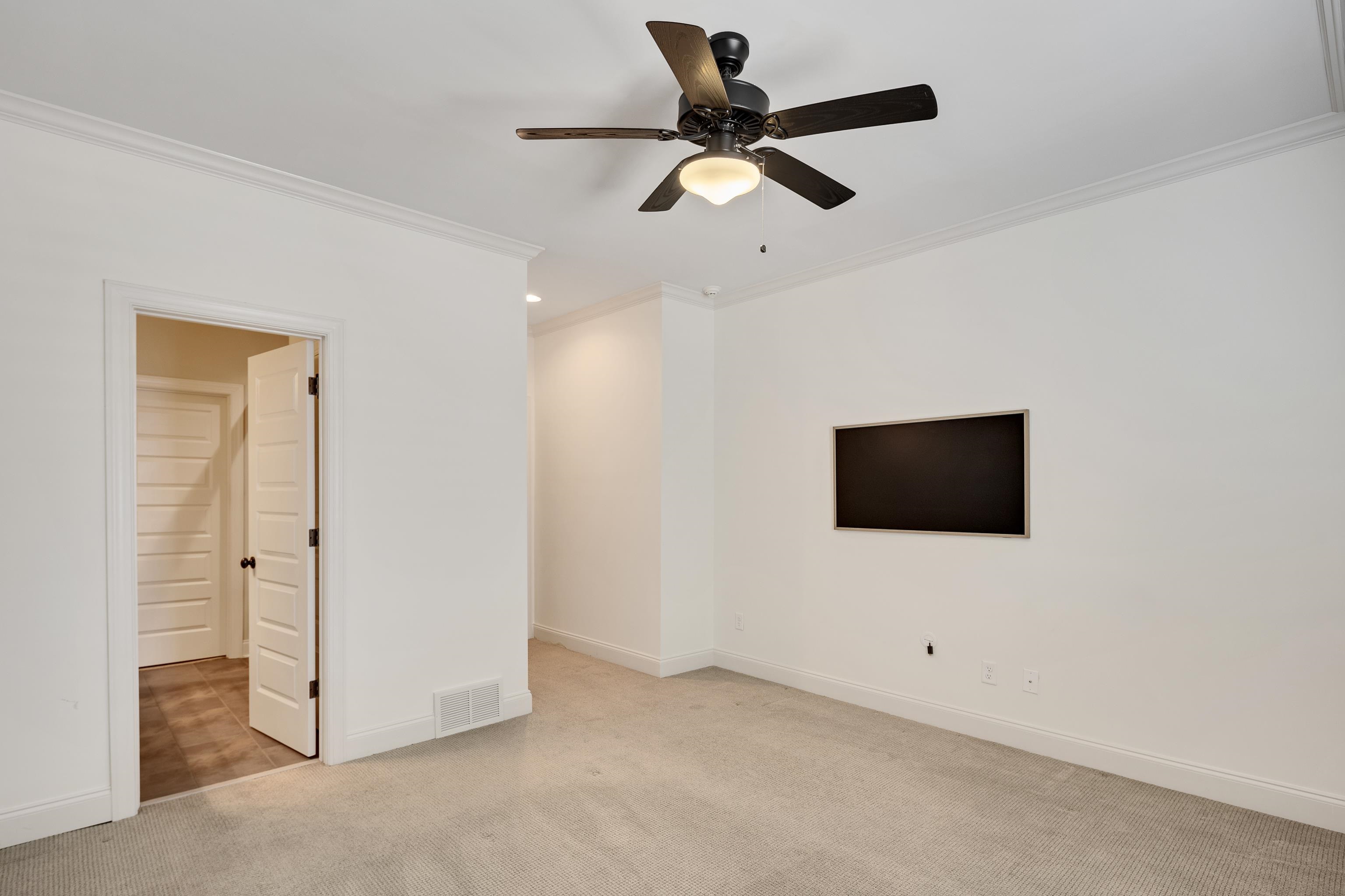 516 Lambs Brook Lane Collierville, TN 38017 - Photo 27 of 39 Unfurnished room with crown molding, ceiling fan, light colored carpet, and recessed lighting