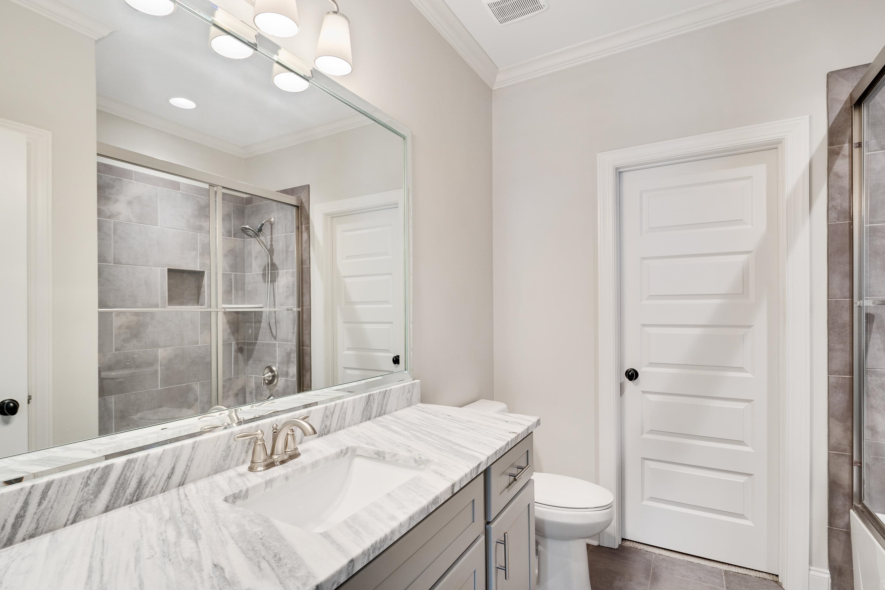 516 Lambs Brook Lane Collierville, TN 38017 - Photo 28 of 39 Full bath with ornamental molding, a tile shower, and vanity