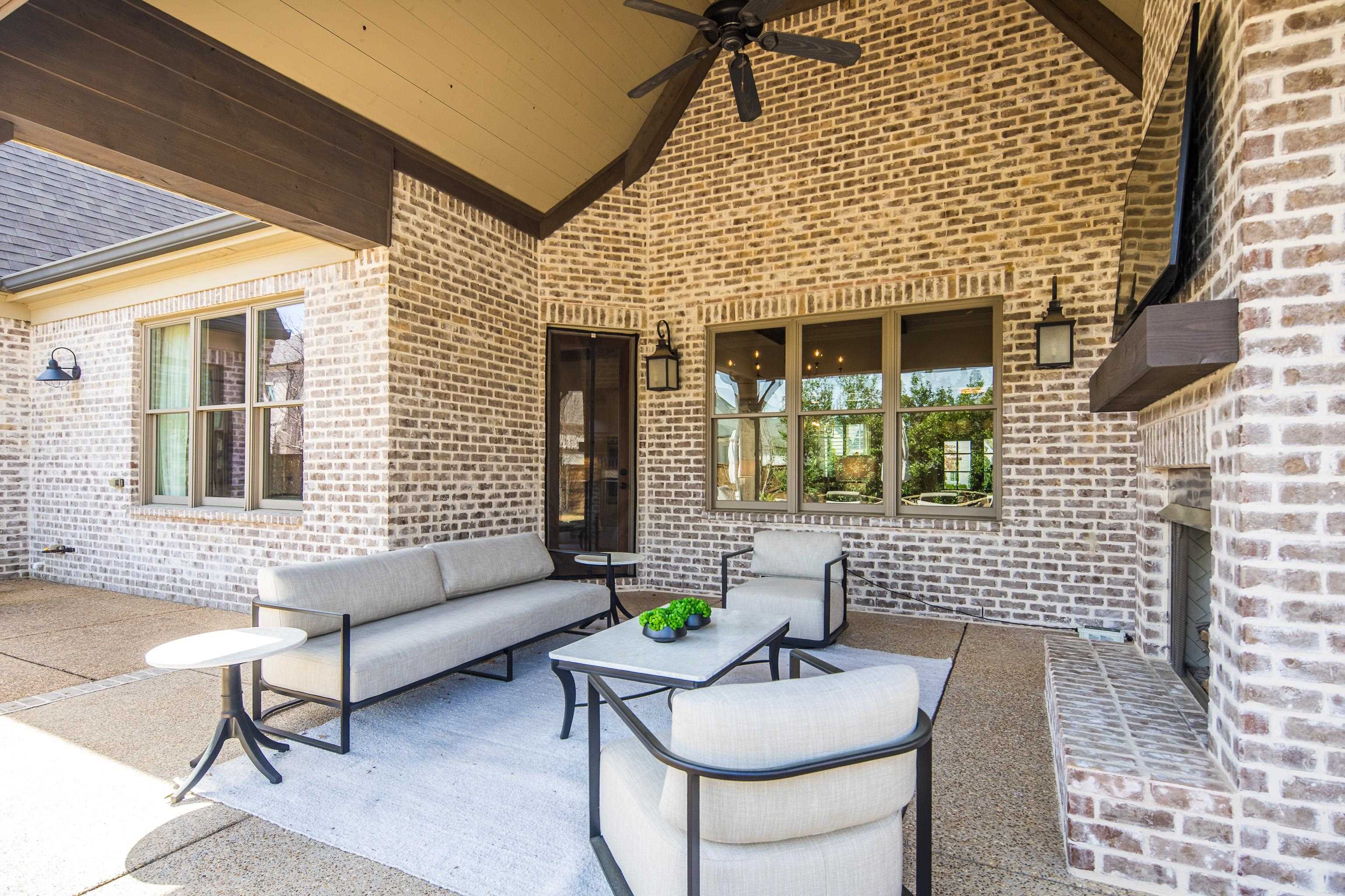 516 Lambs Brook Lane Collierville, TN 38017 - Photo 32 of 39 View of patio / terrace with an outdoor living space with a fireplace and ceiling fan