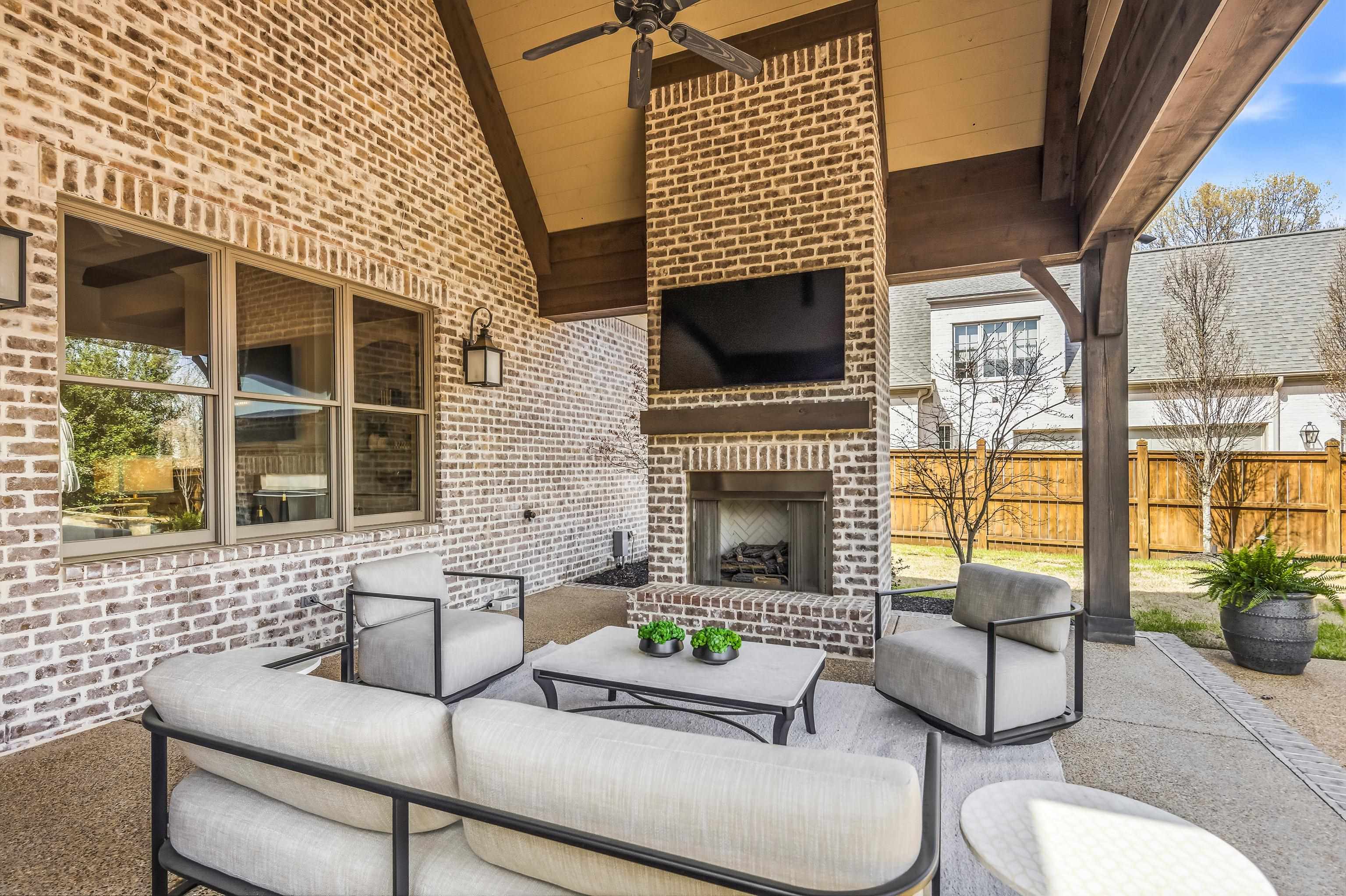 516 Lambs Brook Lane Collierville, TN 38017 - Photo 33 of 39 View of patio with an outdoor living space with a fireplace and ceiling fan