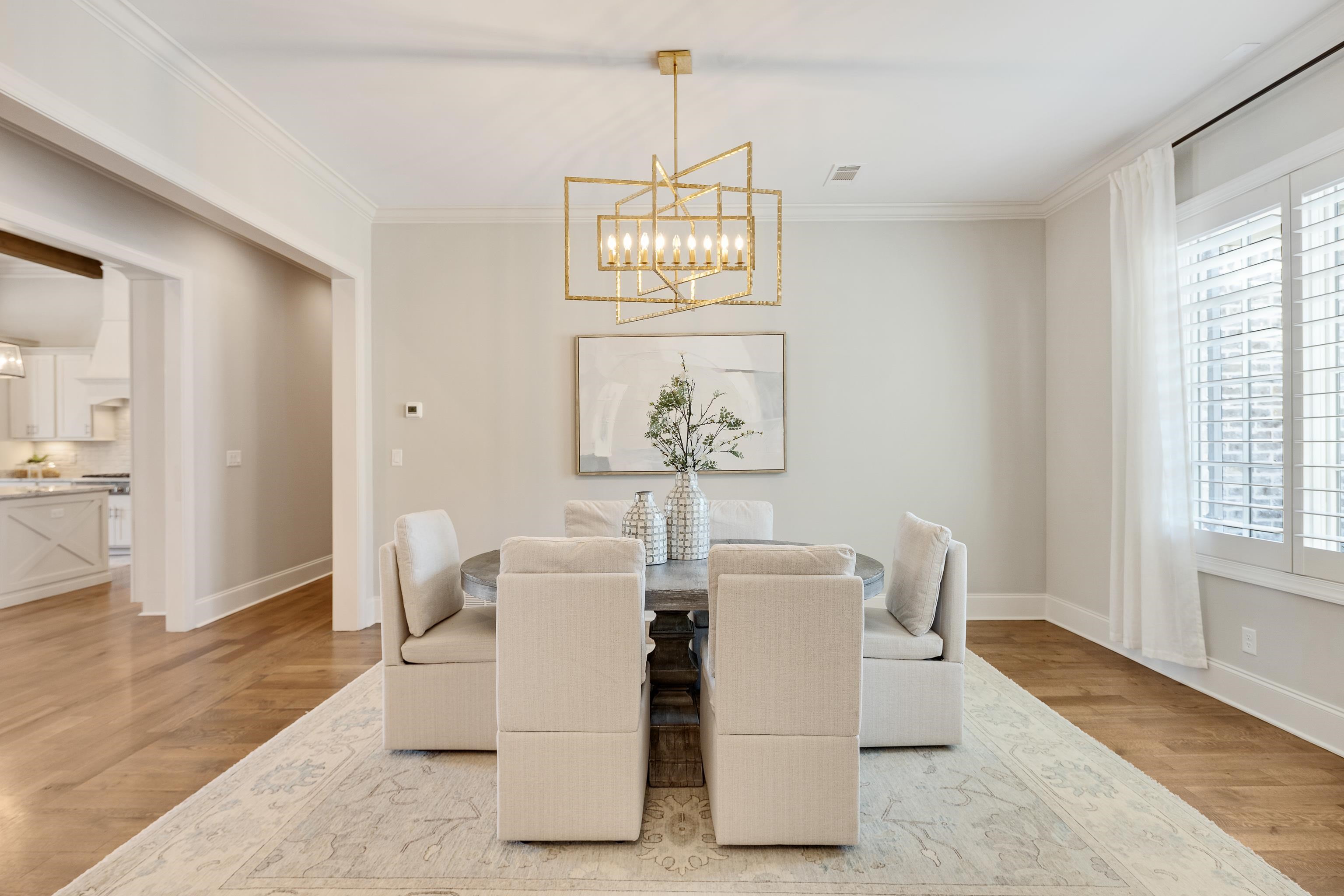 516 Lambs Brook Lane Collierville, TN 38017 - Photo 6 of 39 Dining room featuring hanging lights, light wood-style flooring, and crown molding
