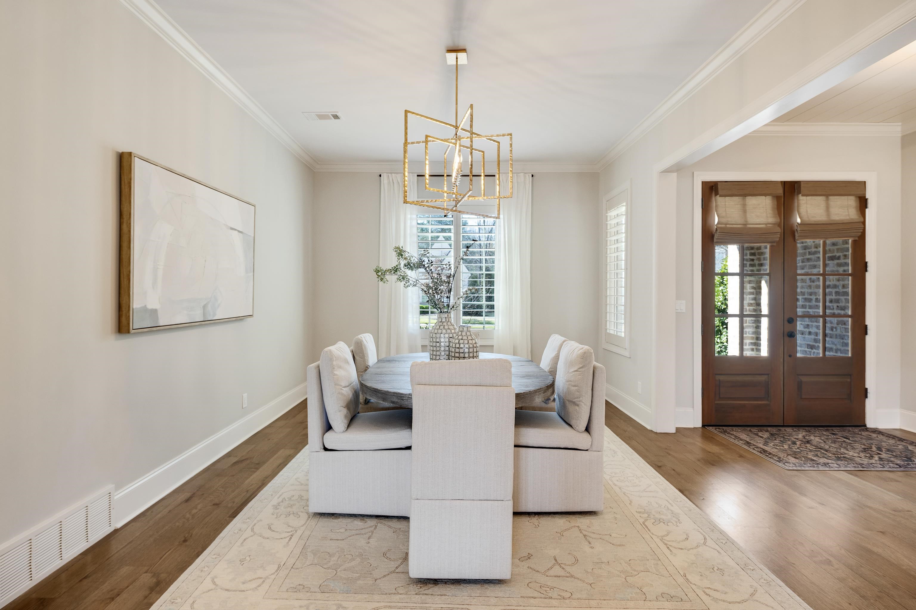 516 Lambs Brook Lane Collierville, TN 38017 - Photo 10 of 39 a dining room with wooden floor and white walls