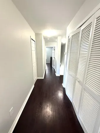 a bed sitting in a room next to a window