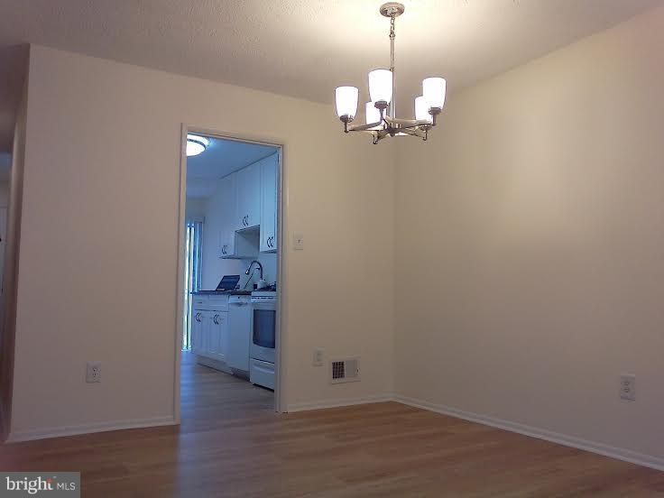 2255 Southgate Square Reston, VA 20191 - Photo 7 of 19 Dining Room - New Flooring & Light Fixtures