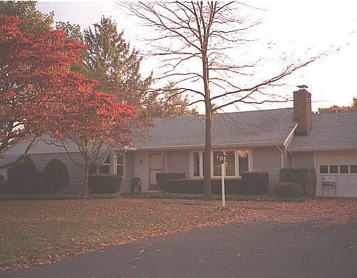 front view of a house with a street