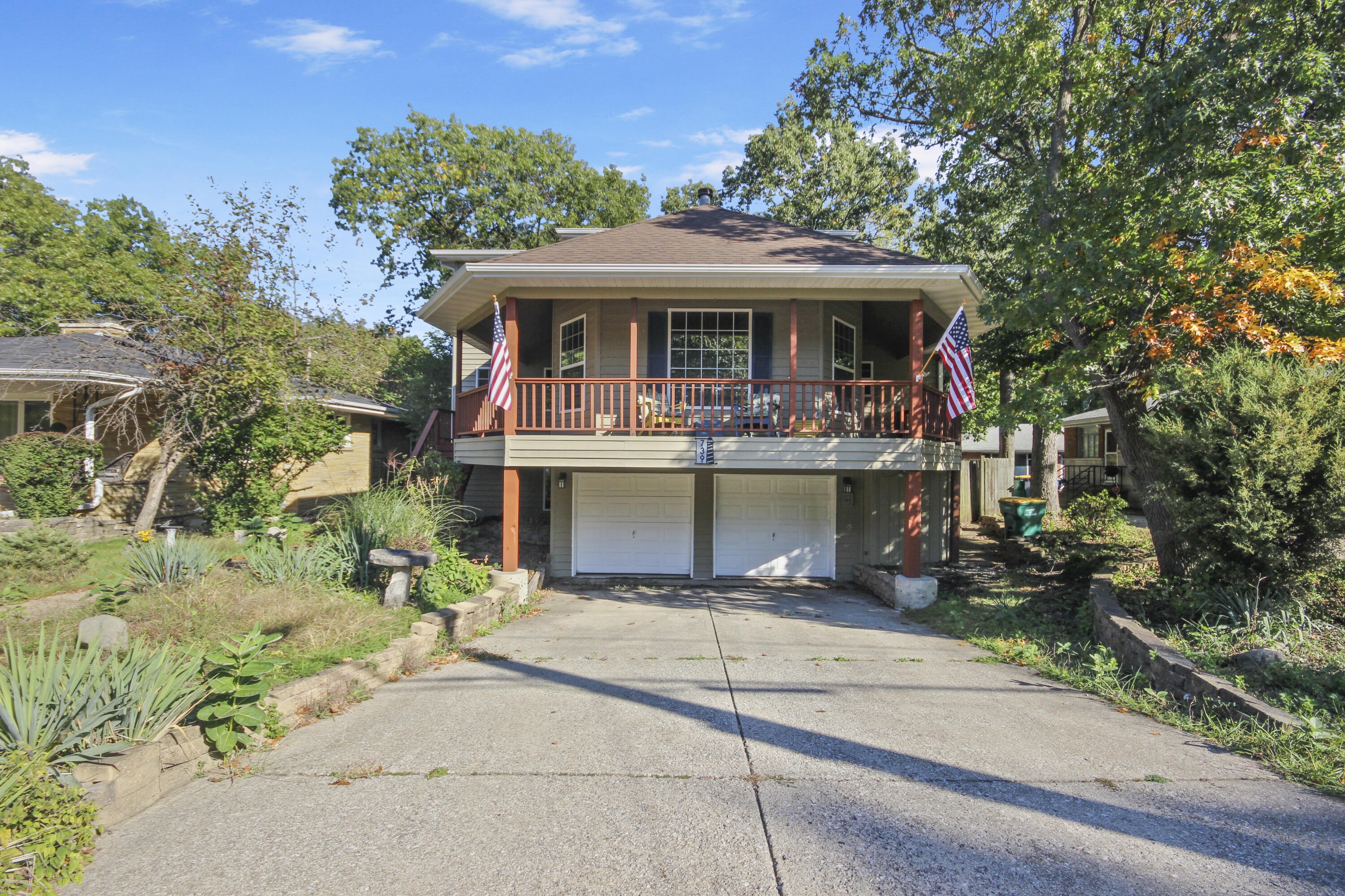 739 Montgomery Street Gary, IN 46403 - Photo 1 of 34 a front view of a house with a porch